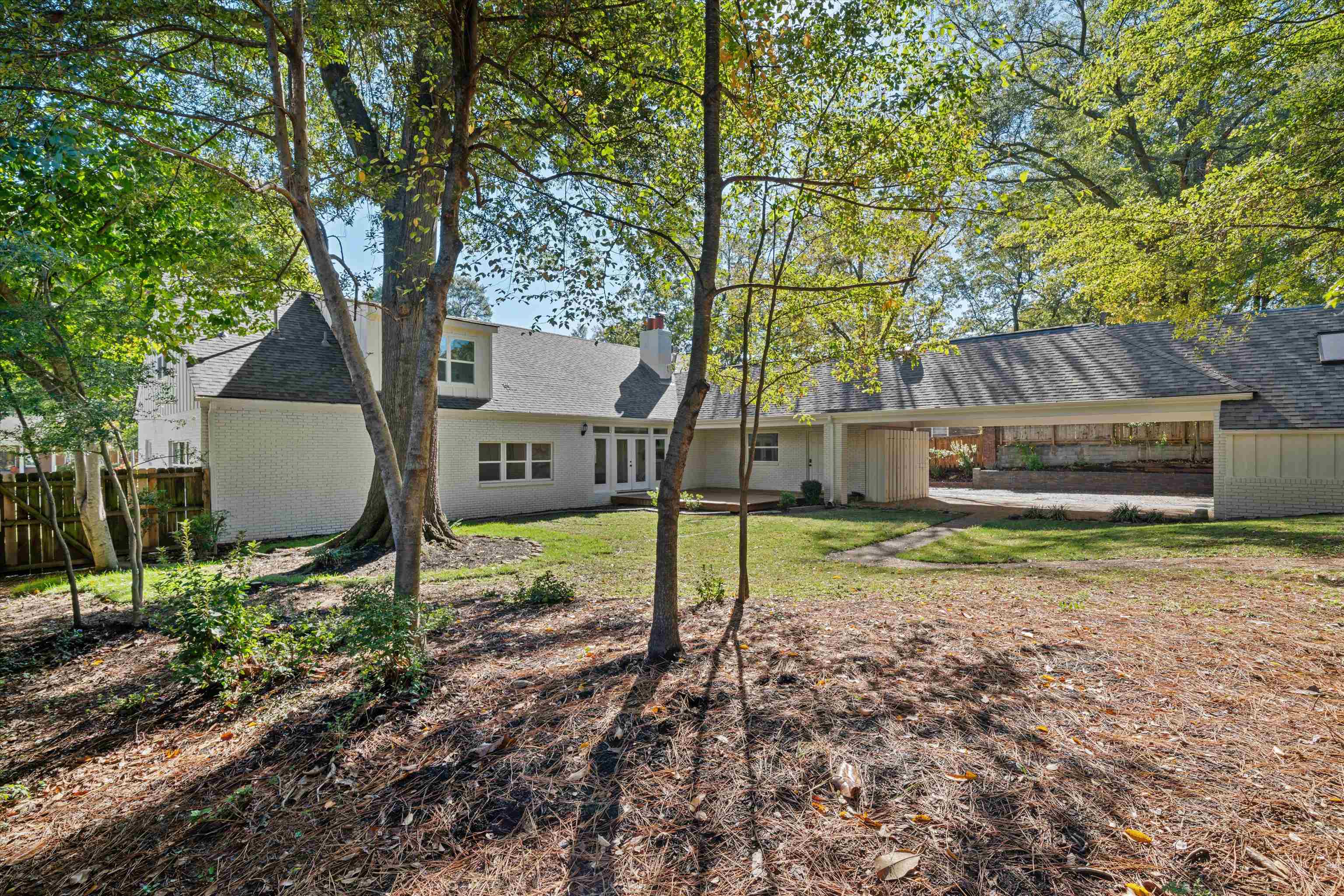 159 Perkins Extension Memphis, TN 38117 - Photo 37 of 37 a view of a house with backyard and a tree