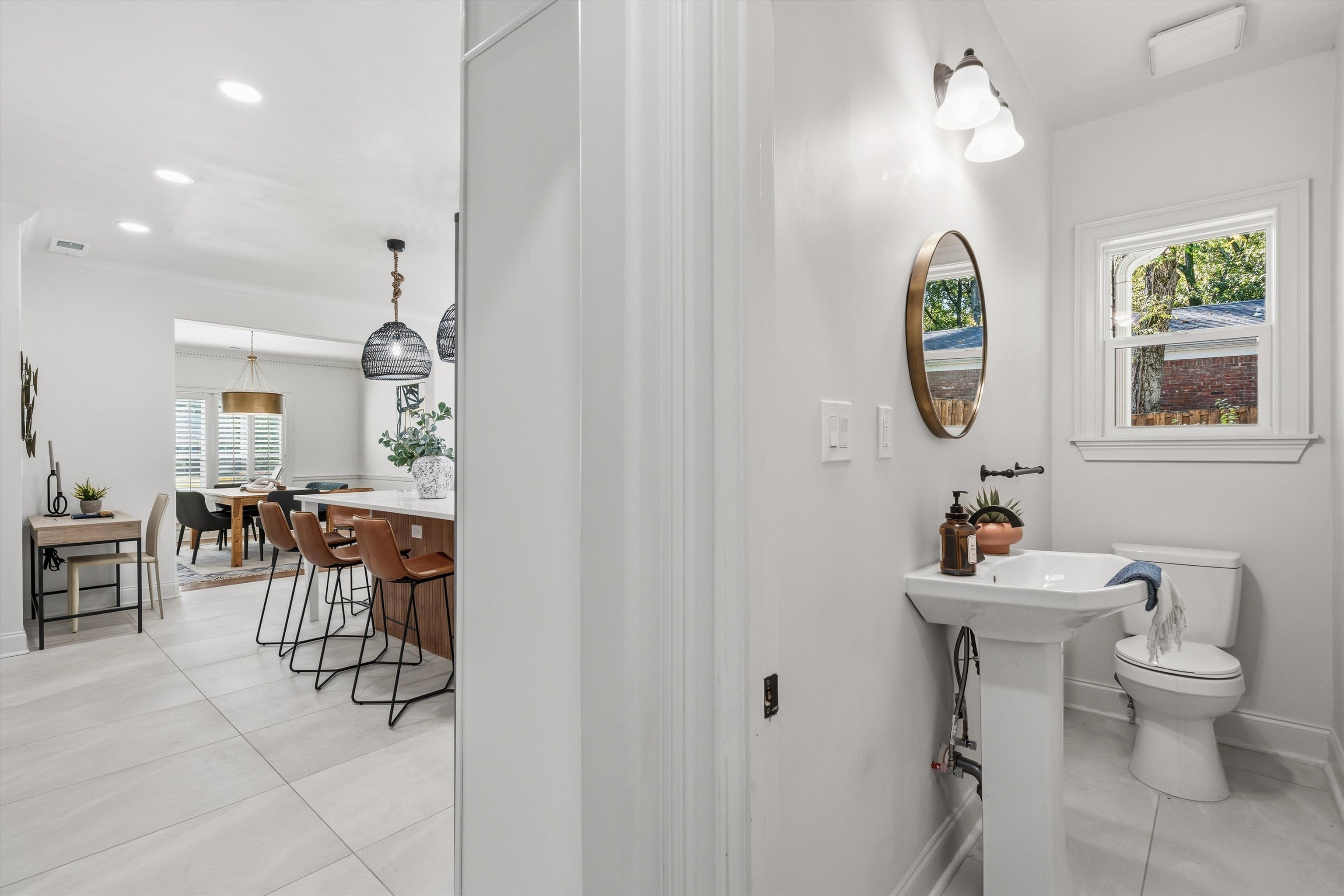 159 Perkins Extension Memphis, TN 38117 - Photo 7 of 37 a bathroom with a sink mirror and toilet