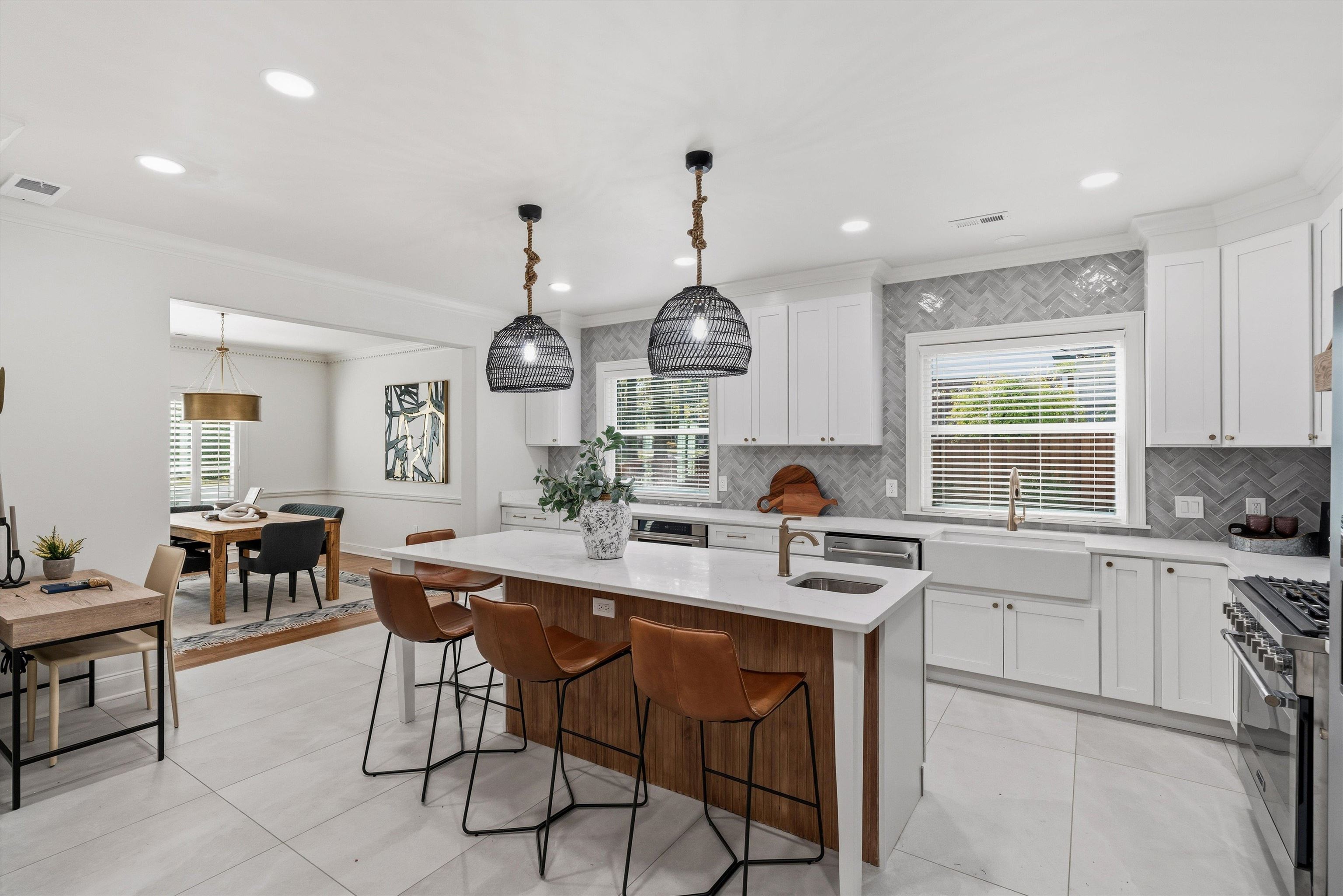 159 Perkins Extension Memphis, TN 38117 - Photo 8 of 37 a kitchen with a dining table chairs sink and cabinets