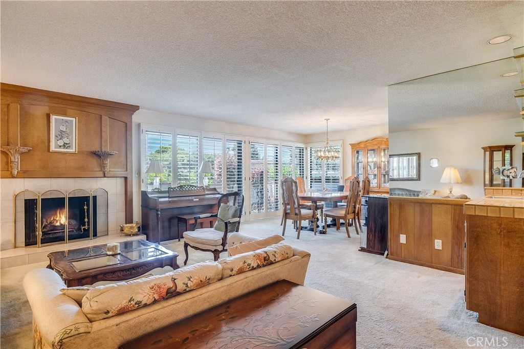 6236 Riviera Circle Long Beach, CA 90815 - Photo 1 of 1 a living room with furniture and a fireplace