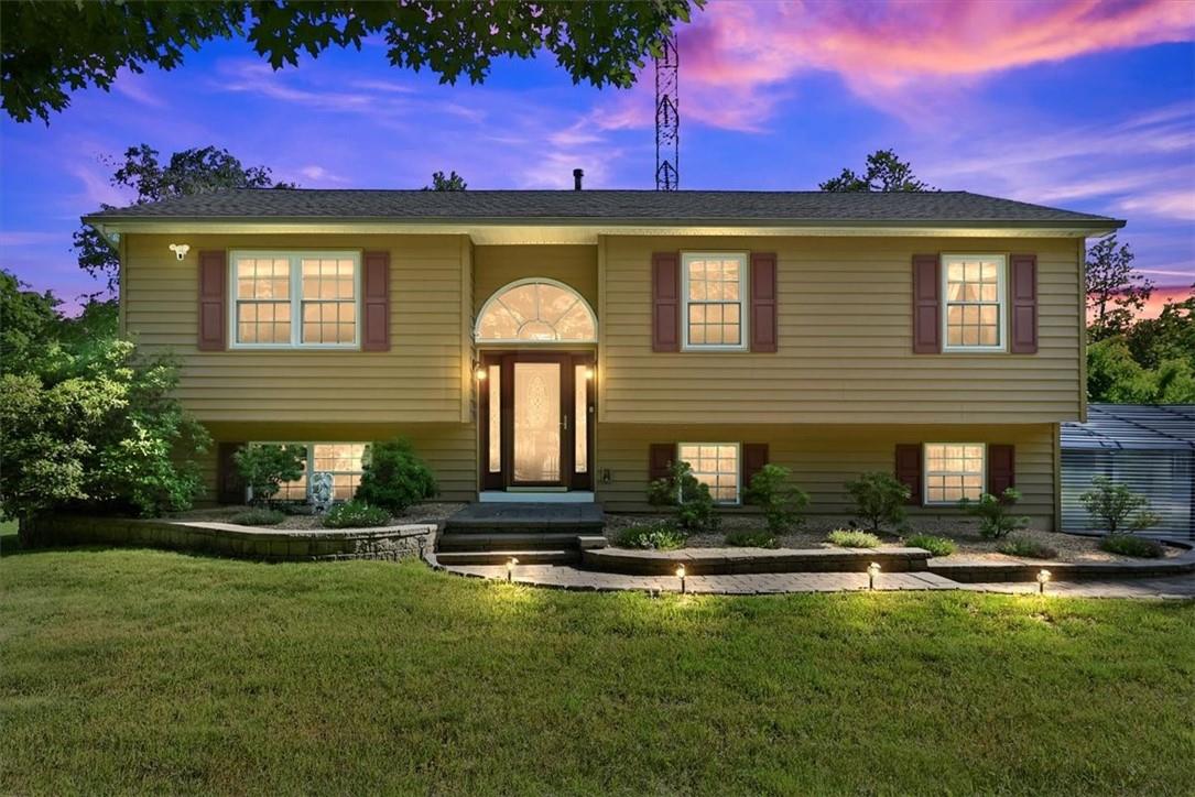 a front view of a house with a yard
