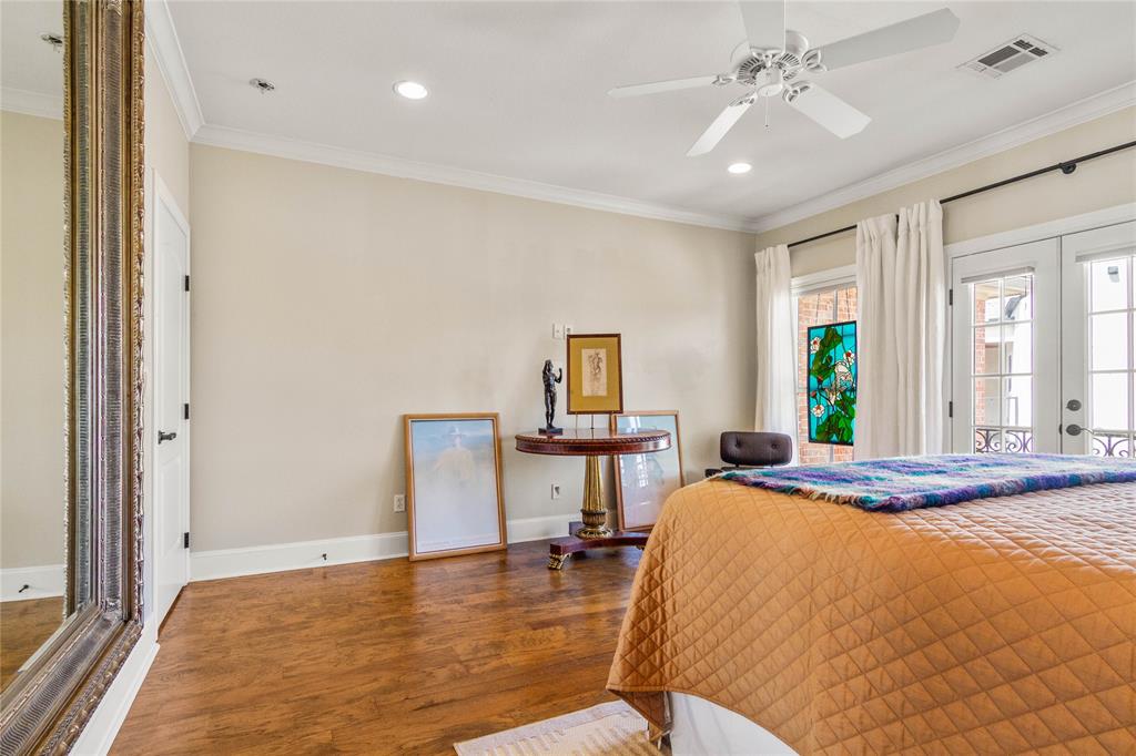 40 Enclave Court Waco, TX 76708 - Photo 20 of 40 a bedroom with a bed and a table in it with window