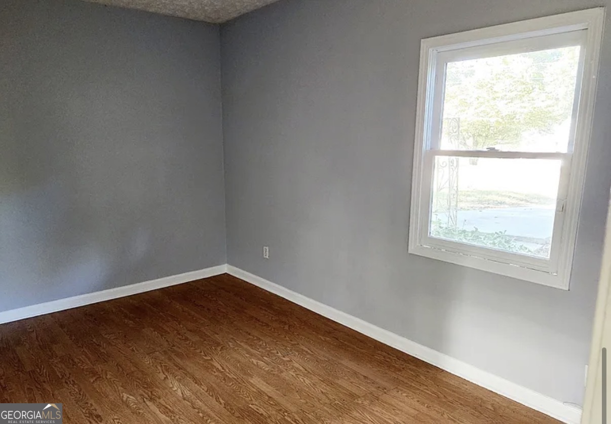 1802 Lee Street Decatur, GA 30035 - Photo 4 of 6 an empty room with a window
