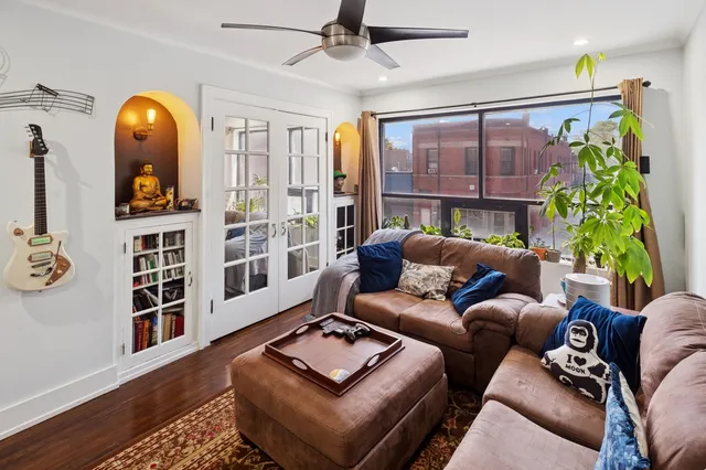 a living room with furniture and a window