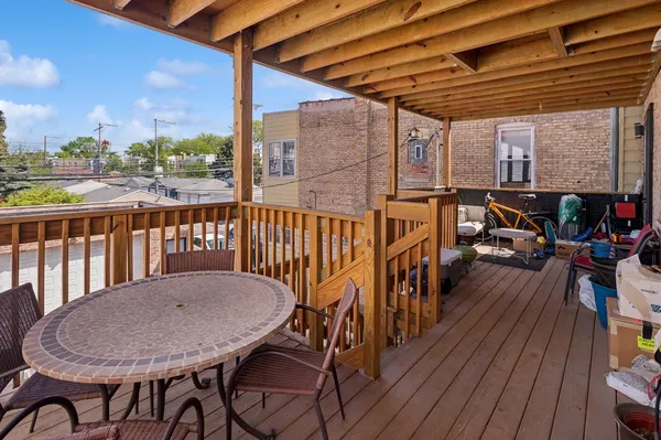 a view of a balcony with furniture