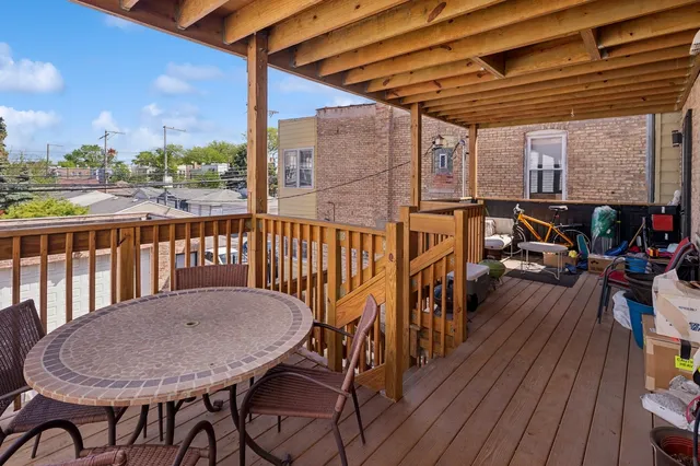 a view of a balcony with furniture