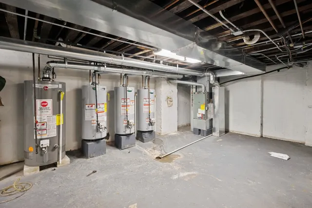 a bathroom with a sink a stove and cabinets