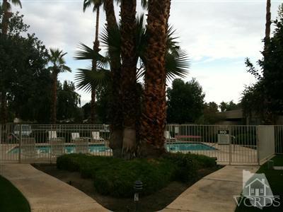 71994 Eleanora Lane Rancho Mirage, CA 92270 - Photo 4 of 9 a view of a park with iron fence