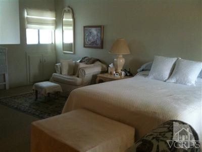 71994 Eleanora Lane Rancho Mirage, CA 92270 - Photo 5 of 9 a bedroom with a bed and a couch