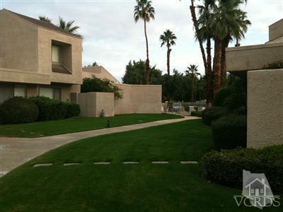 71994 Eleanora Lane Rancho Mirage, CA 92270 - Photo 8 of 9 a backyard of a house with lots of green space and plants