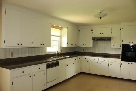 165 Gose Road Forsyth, GA 31029 - Photo 4 of 12 a kitchen with granite countertop white cabinets and sink