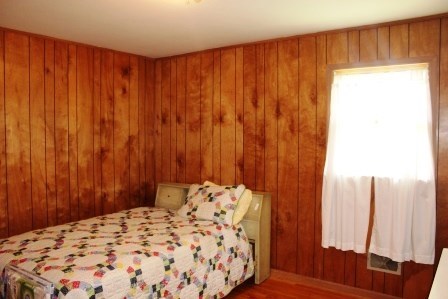 165 Gose Road Forsyth, GA 31029 - Photo 8 of 12 a bedroom with a bed and a curtain