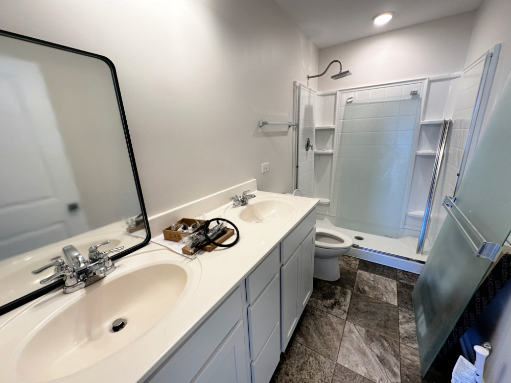 208 Goldenrod Drive, Unit 1 Elgin, IL 60124 - Photo 12 of 17 a bathroom with a sink toilet and shower