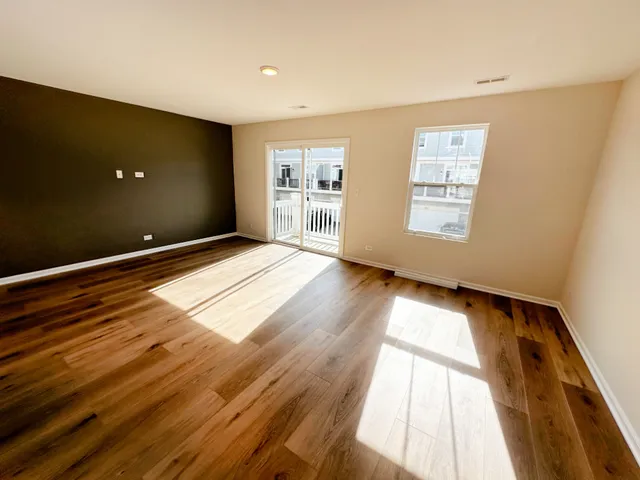 a view of an empty room and a window