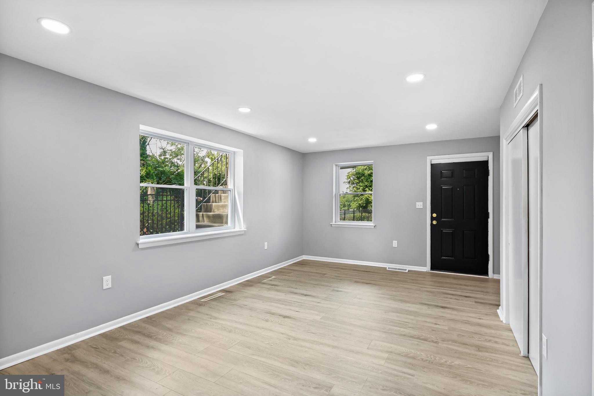 5636 Purdue Avenue Baltimore, MD 21239 - Photo 17 of 39 an empty room with windows and closet