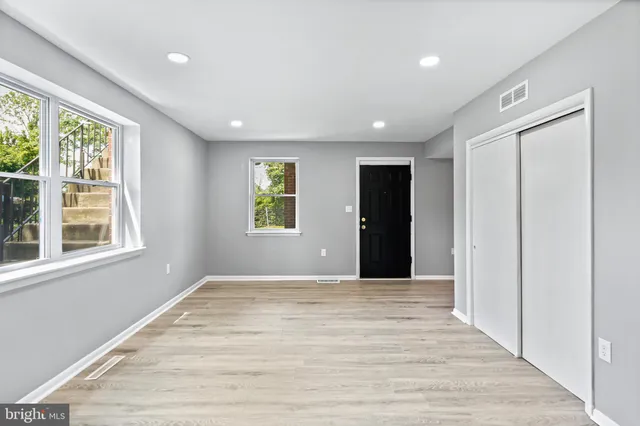 a view of an empty room with a window