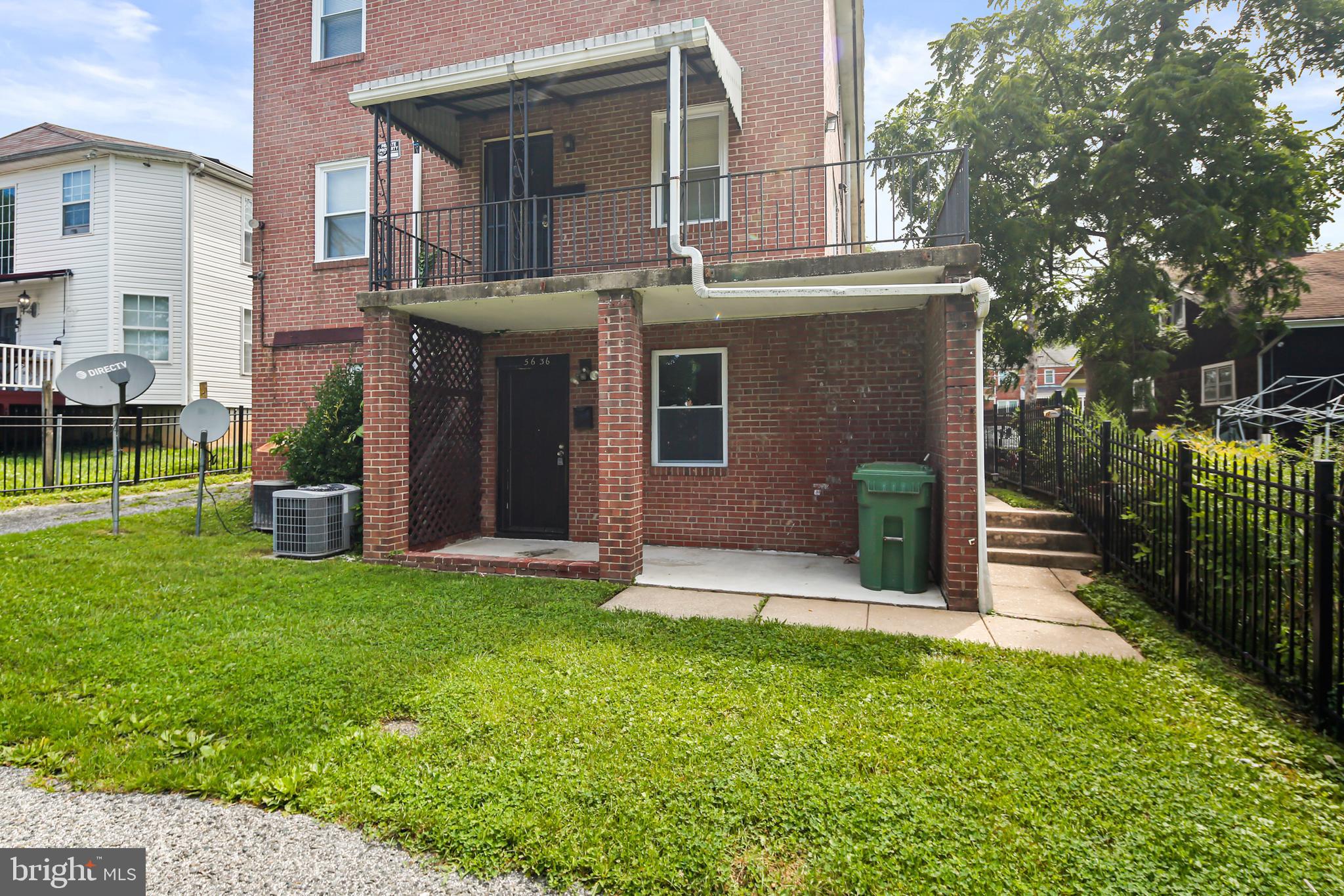 5636 Purdue Avenue Baltimore, MD 21239 - Photo 2 of 39 a view of a house with a yard and sitting area