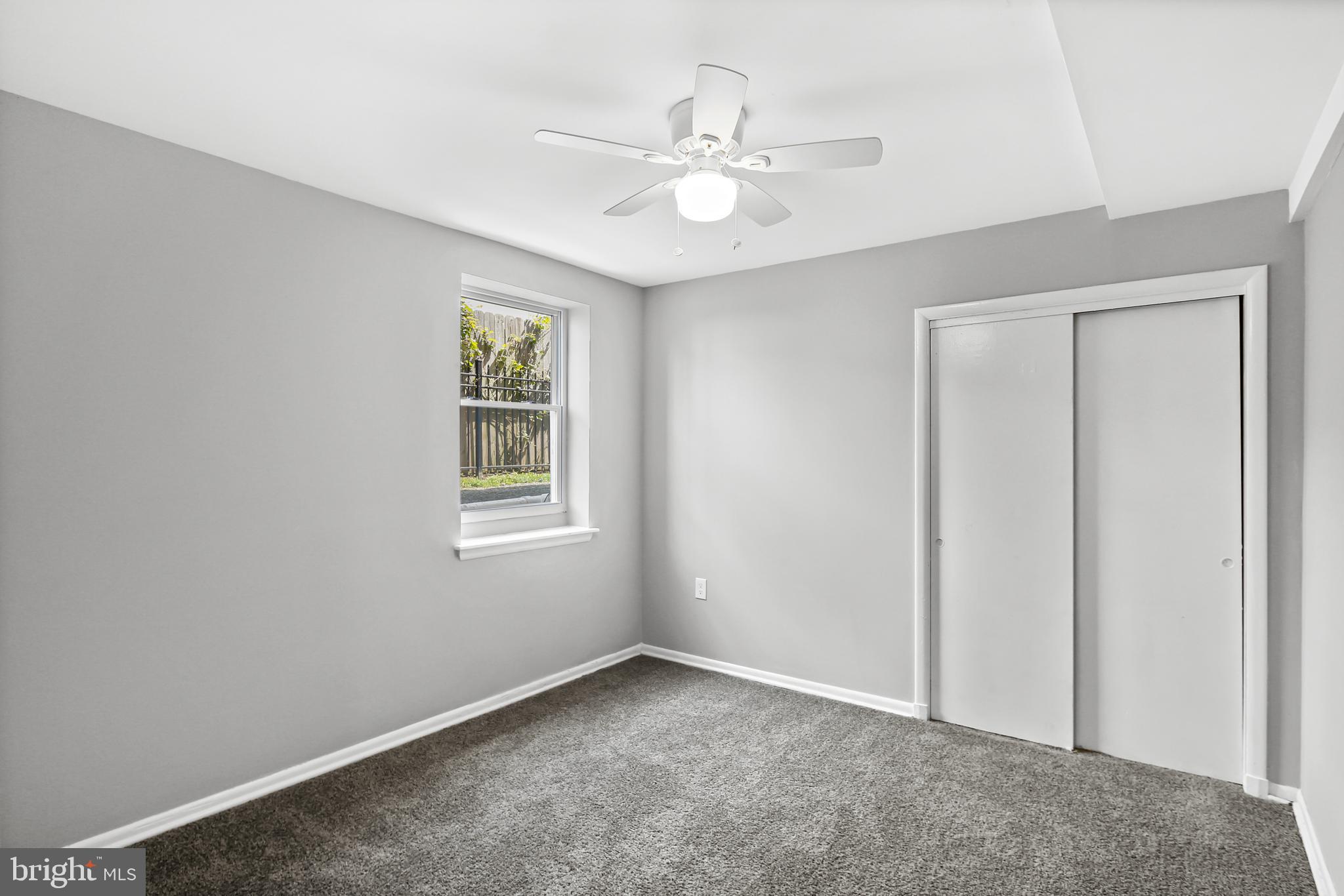 5636 Purdue Avenue Baltimore, MD 21239 - Photo 23 of 39 a view of an empty room with a window