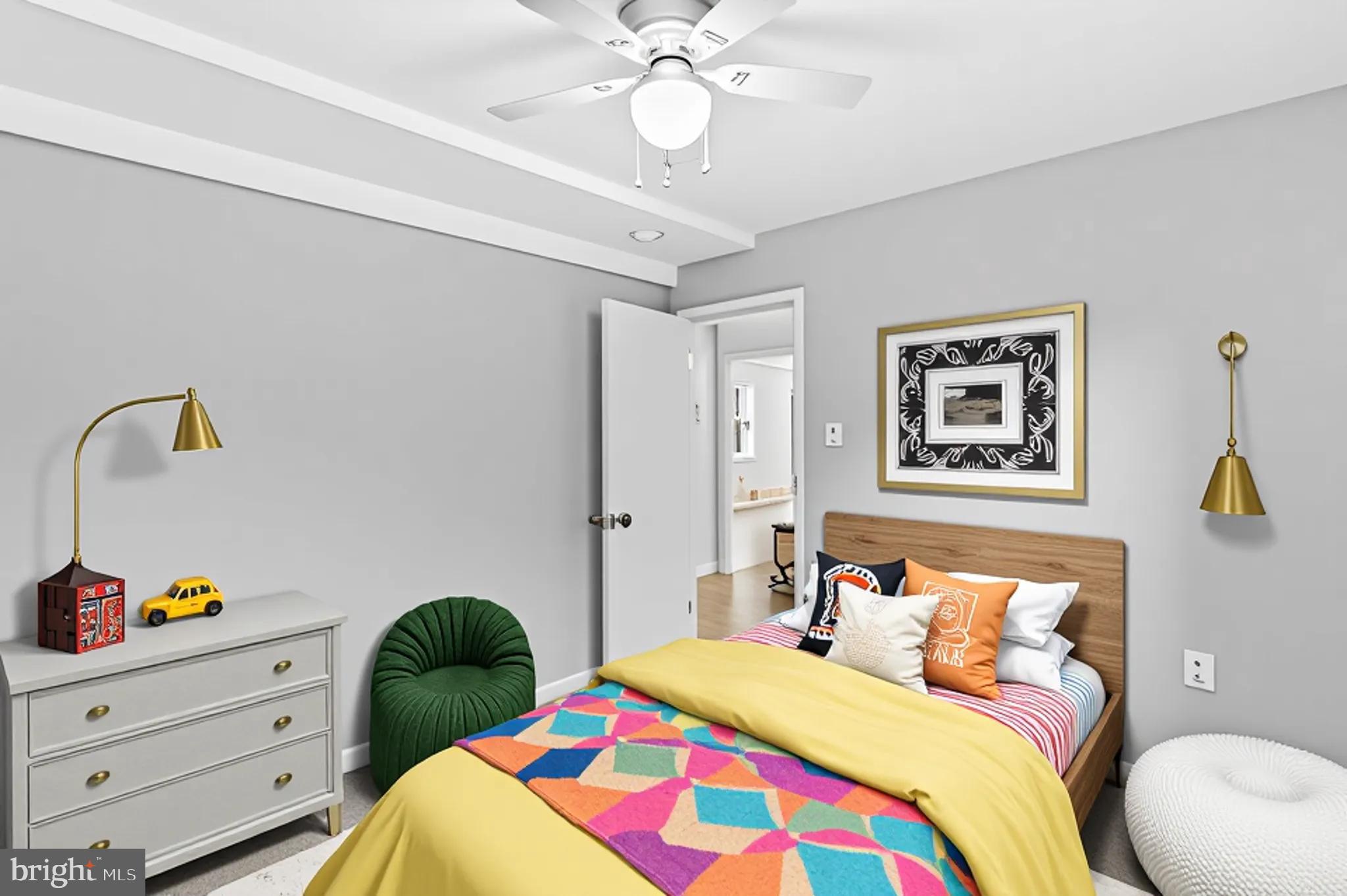 5636 Purdue Avenue Baltimore, MD 21239 - Photo 26 of 39 a bedroom with a bed and a chandelier