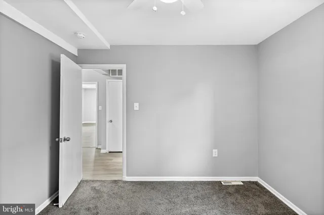 a view of a room with a hallway