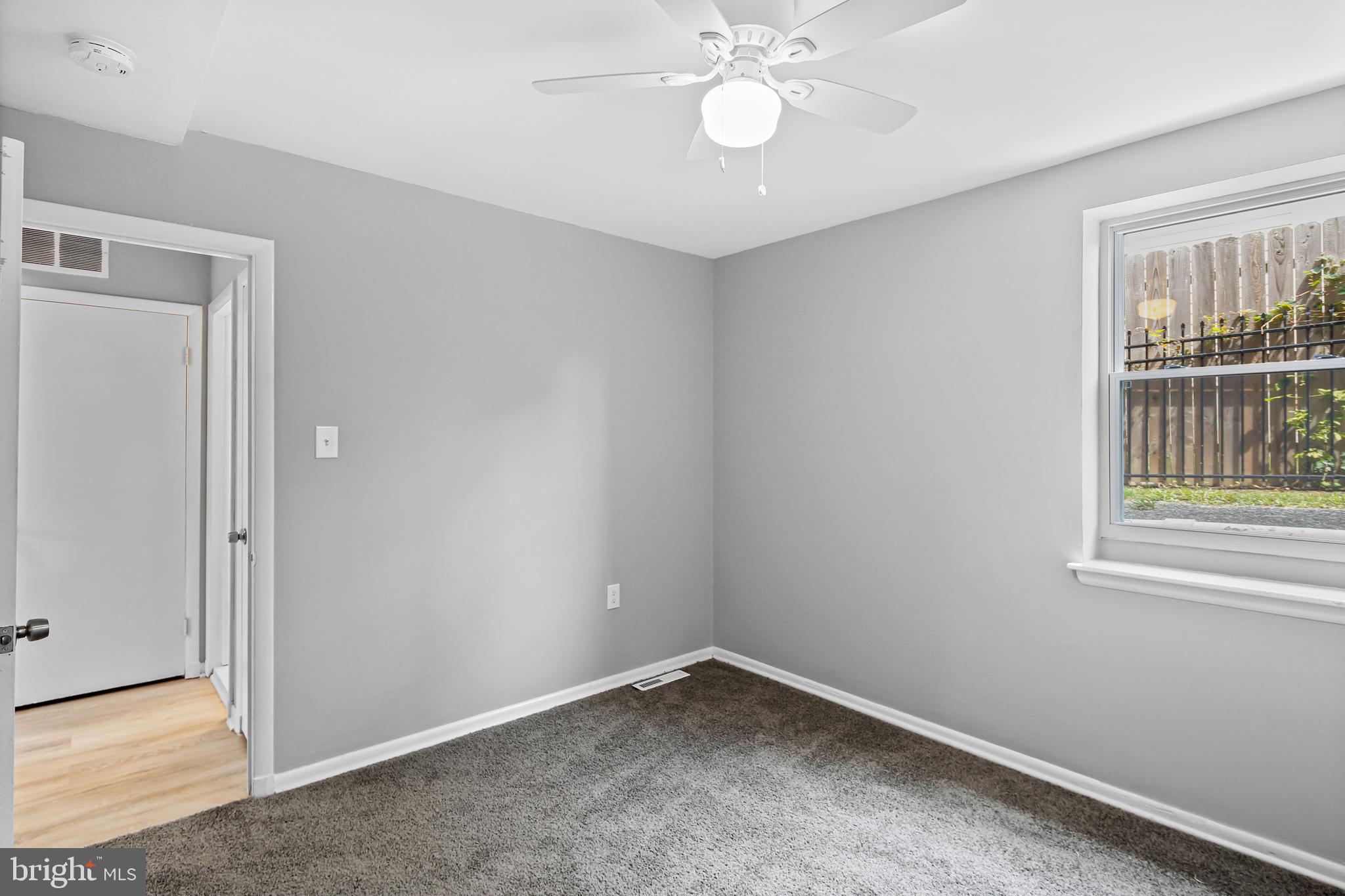 5636 Purdue Avenue Baltimore, MD 21239 - Photo 29 of 39 a view of an empty room with a window