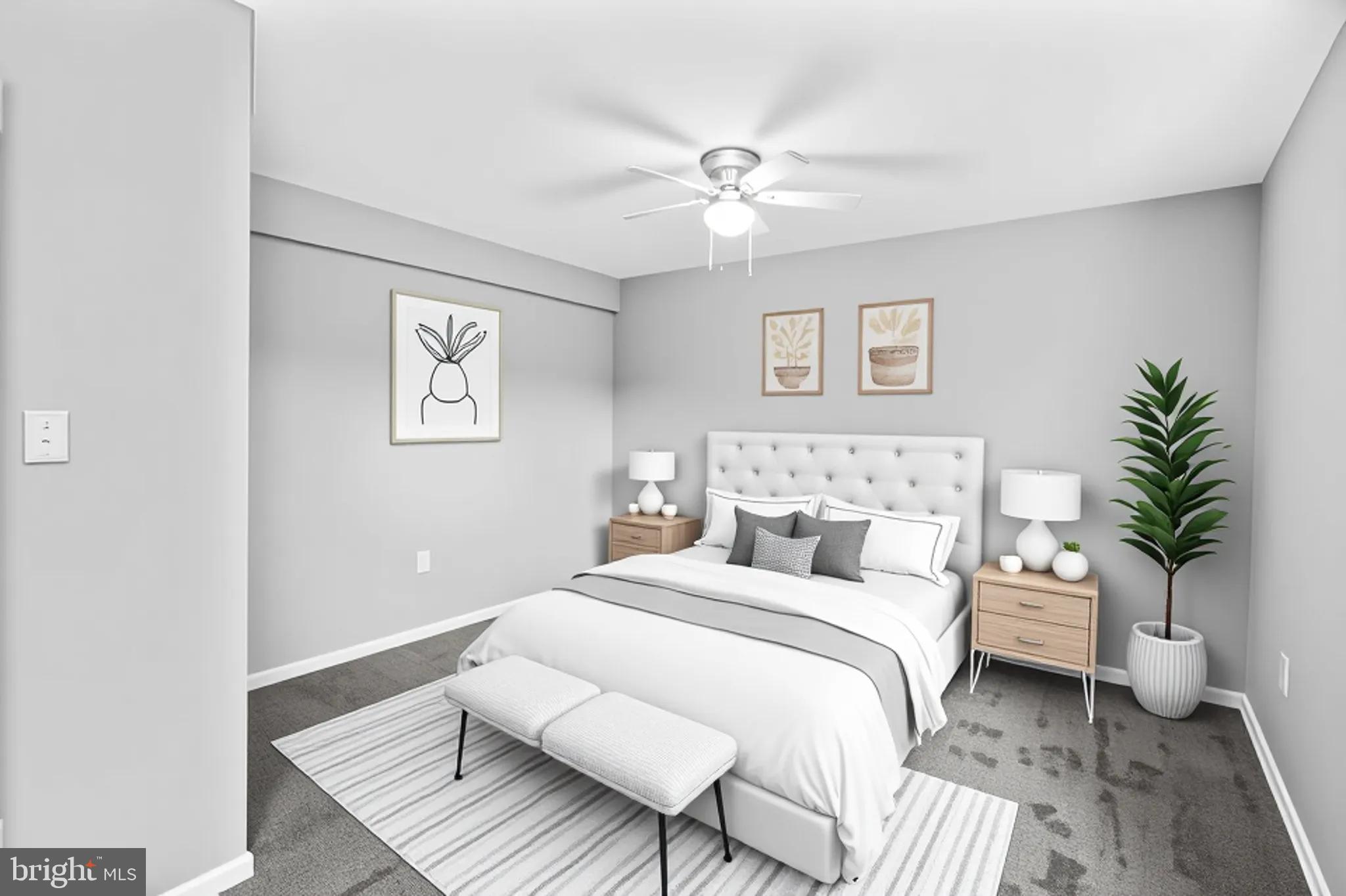 5636 Purdue Avenue Baltimore, MD 21239 - Photo 32 of 39 a bedroom with a large bed and a chandelier