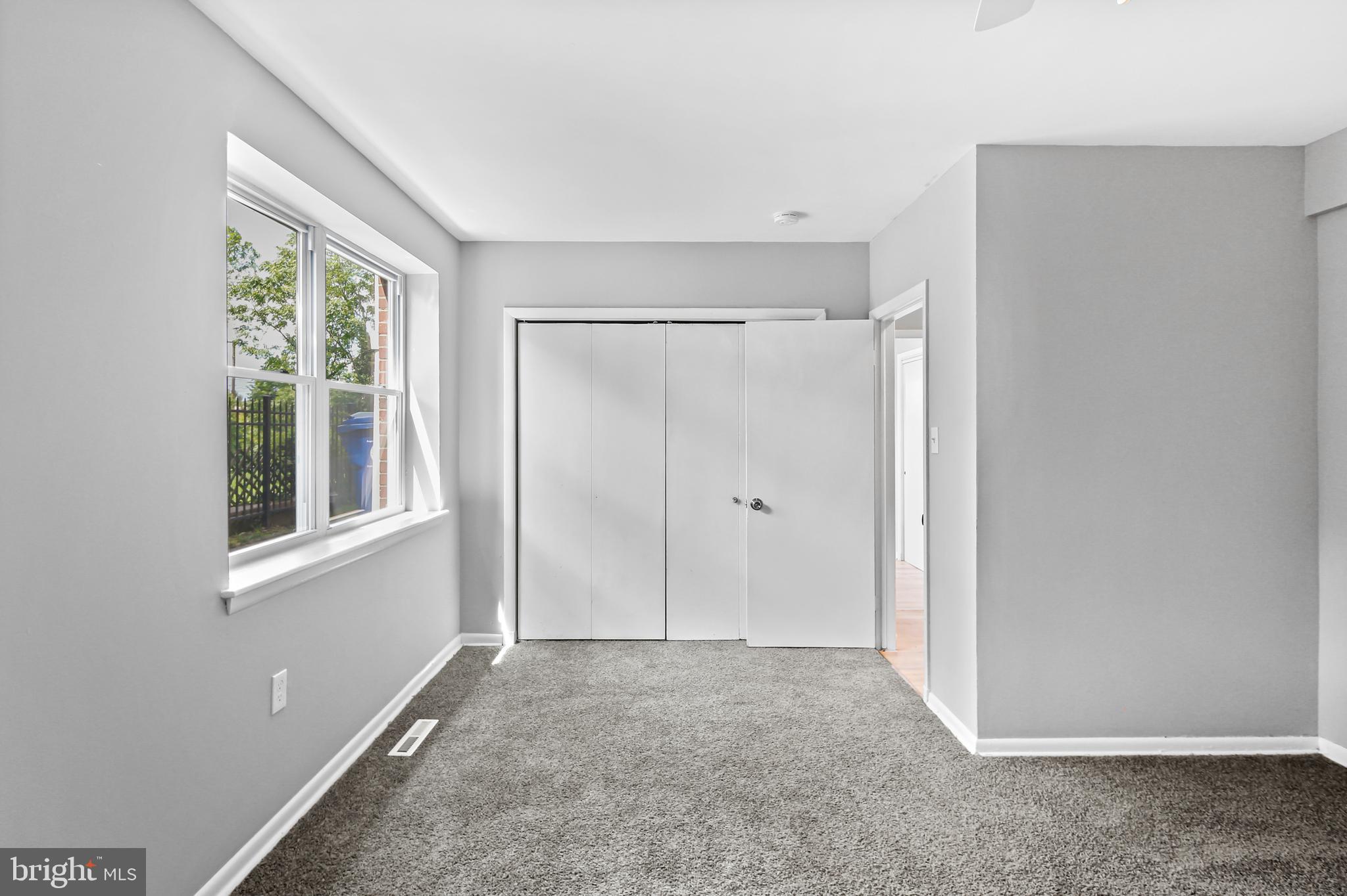 5636 Purdue Avenue Baltimore, MD 21239 - Photo 38 of 39 a view of an empty room with a window