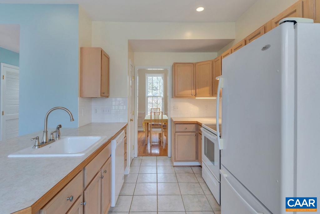 320 Starcrest Road Charlottesville, VA 22902 - Photo 15 of 38 a kitchen with a sink stove and refrigerator