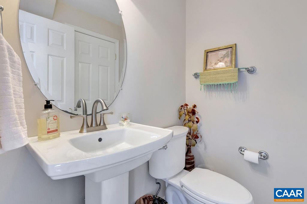 320 Starcrest Road Charlottesville, VA 22902 - Photo 21 of 38 a bathroom with a sink mirror and toilet