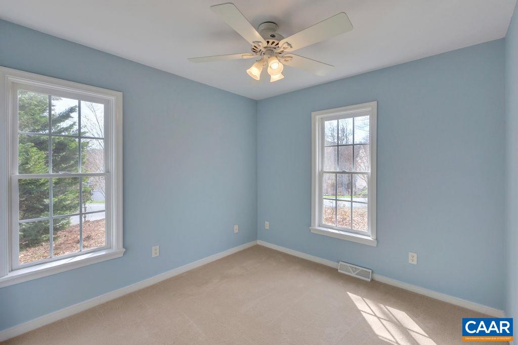 320 Starcrest Road Charlottesville, VA 22902 - Photo 25 of 38 an empty room with windows and ceiling fan