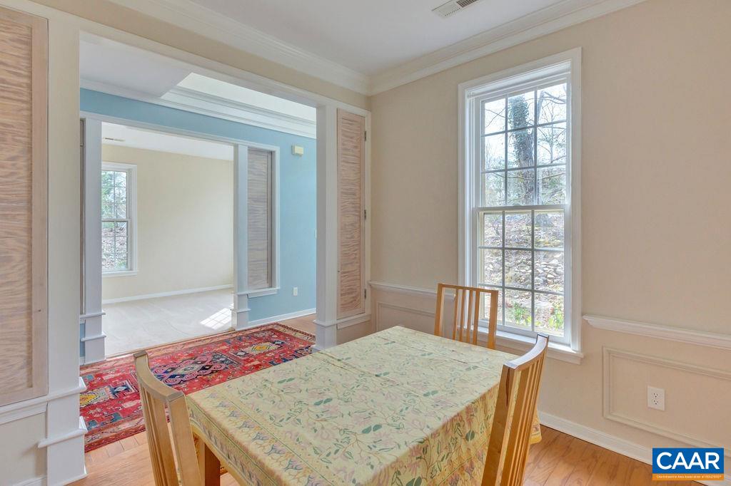 320 Starcrest Road Charlottesville, VA 22902 - Photo 6 of 38 a view of a dining table and chairs in a room