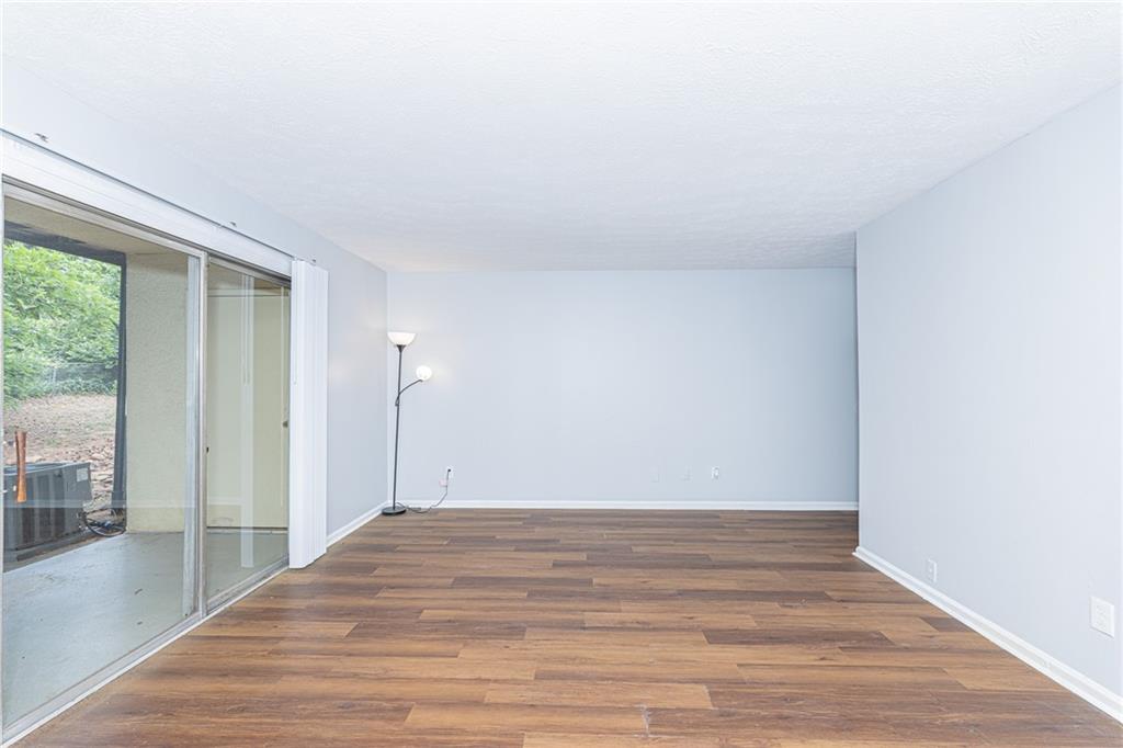 2398 Lawrenceville Highway, Unit U Decatur, GA 30033 - Photo 13 of 32 a view of a room with wooden floor and fan