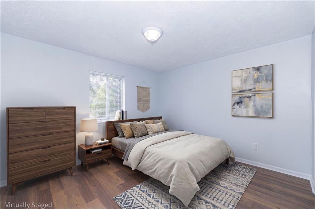 2398 Lawrenceville Highway, Unit U Decatur, GA 30033 - Photo 23 of 32 a bedroom with a bed and a night stand