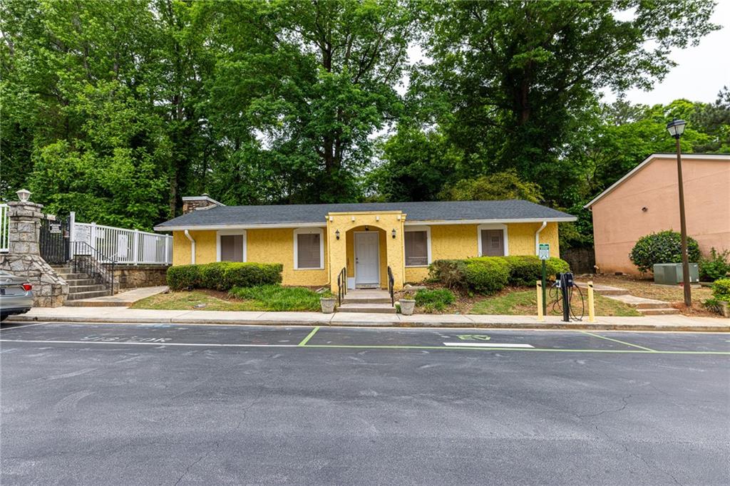 2398 Lawrenceville Highway, Unit U Decatur, GA 30033 - Photo 29 of 32 front view of a house next to a yard