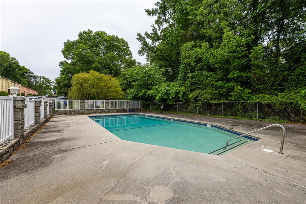 2398 Lawrenceville Highway, Unit U Decatur, GA 30033 - Photo 31 of 32 a view of backyard with swimming pool and trees in the background
