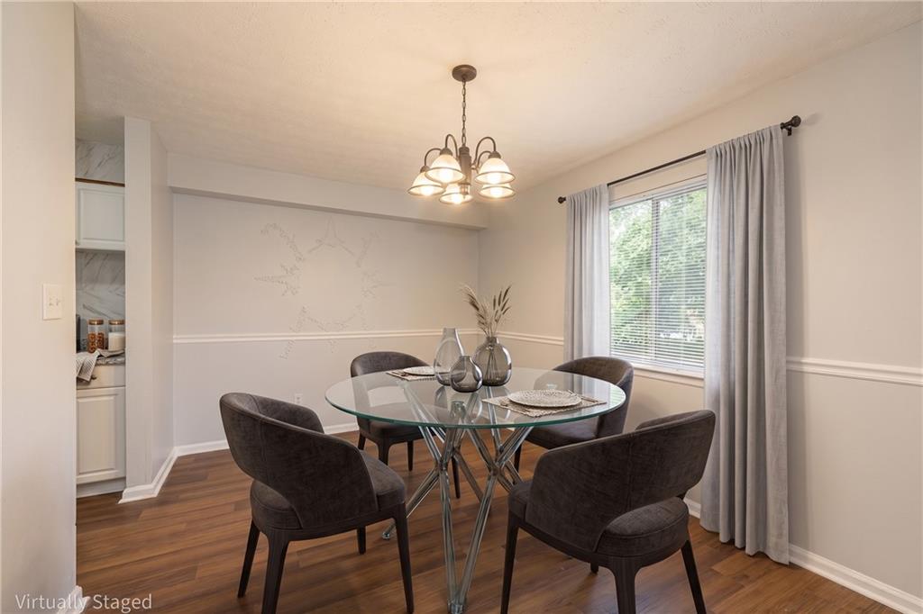 2398 Lawrenceville Highway, Unit U Decatur, GA 30033 - Photo 6 of 32 a dining room with furniture a window and wooden floor