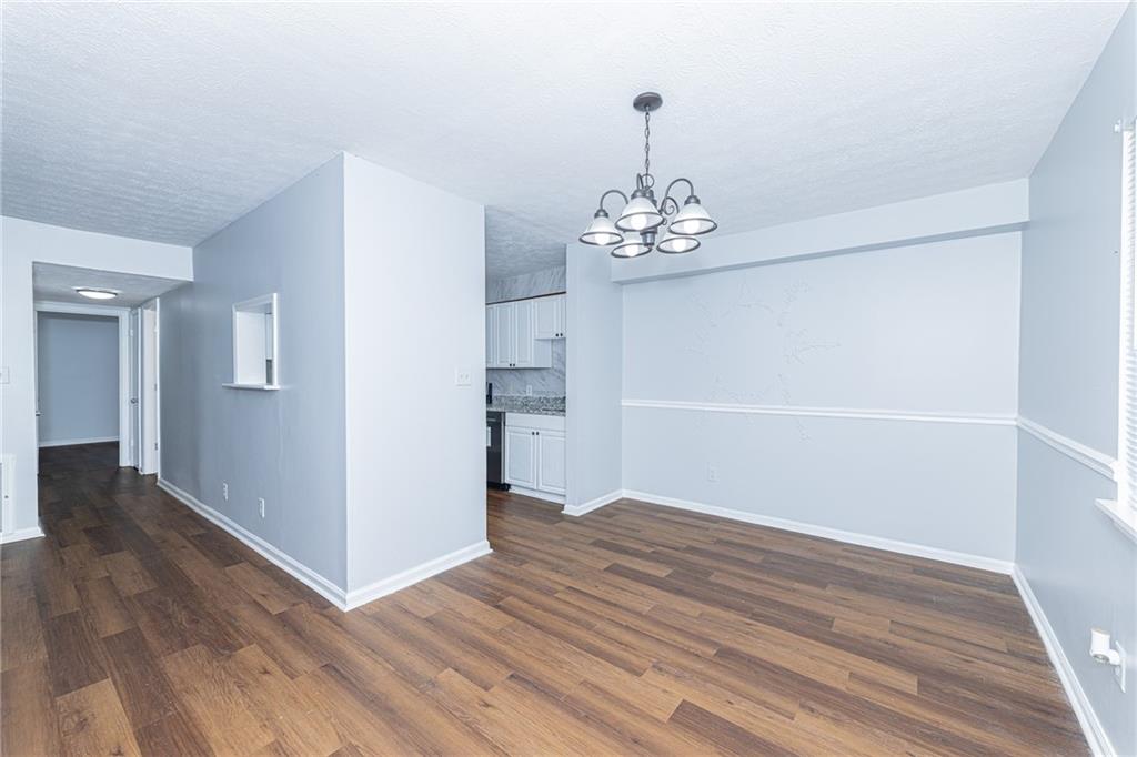 2398 Lawrenceville Highway, Unit U Decatur, GA 30033 - Photo 8 of 32 a view of empty room with wooden floor