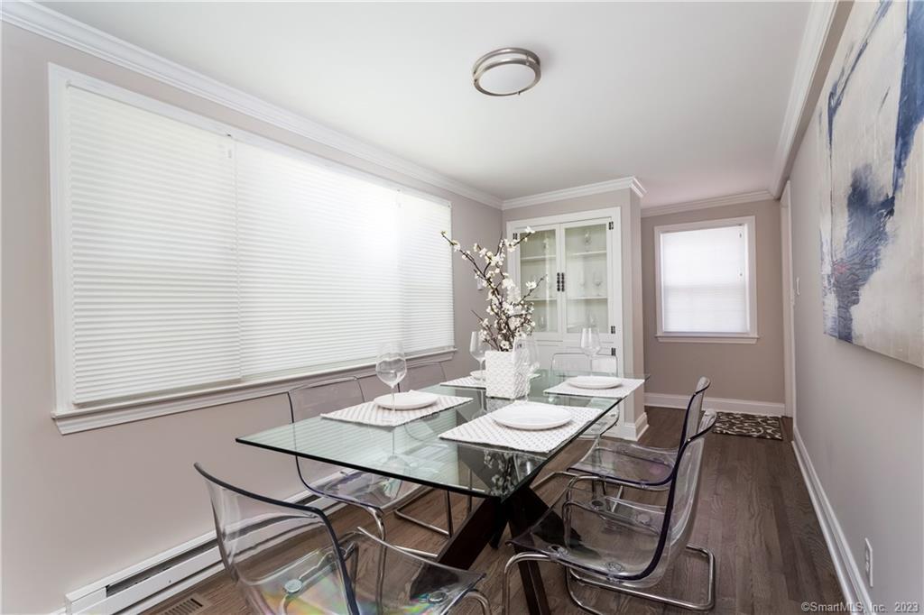 1748 Stratfield Road Fairfield, CT 06825 - Photo 11 of 30 a view of a dining room with furniture and window