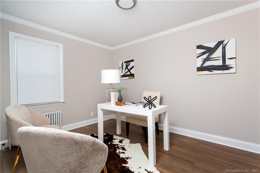 1748 Stratfield Road Fairfield, CT 06825 - Photo 13 of 30 a living room with furniture and a wooden floor