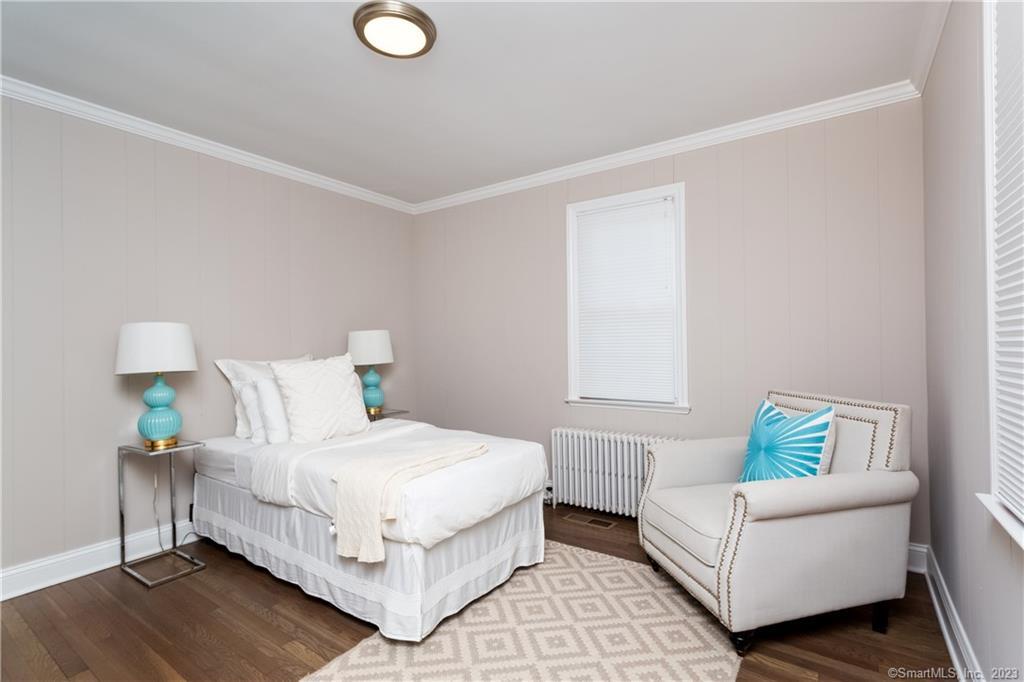 1748 Stratfield Road Fairfield, CT 06825 - Photo 14 of 30 a bedroom with a bed and a couch