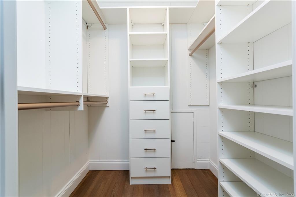 1748 Stratfield Road Fairfield, CT 06825 - Photo 19 of 30 a view of walk in closet with empty racks