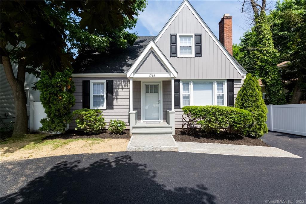 1748 Stratfield Road Fairfield, CT 06825 - Photo 2 of 30 a view of front house with potted plants and a large tree
