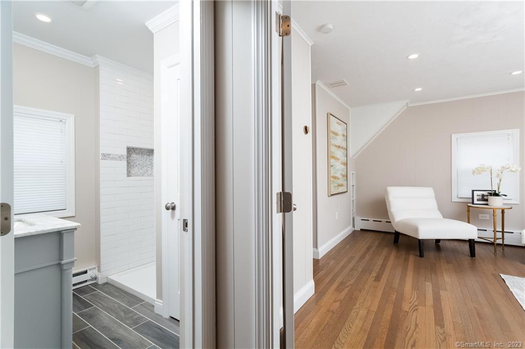 1748 Stratfield Road Fairfield, CT 06825 - Photo 21 of 30 a living room with furniture and a wooden floor
