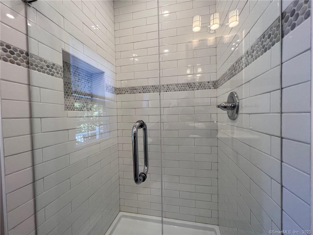 1748 Stratfield Road Fairfield, CT 06825 - Photo 22 of 30 a bathroom with a shower