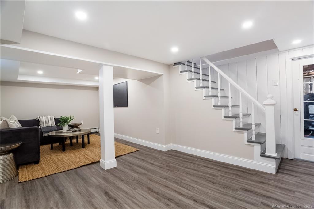 1748 Stratfield Road Fairfield, CT 06825 - Photo 26 of 30 a view of entryway with wooden floor and stairs