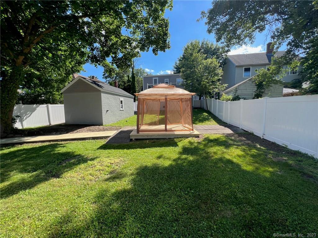 1748 Stratfield Road Fairfield, CT 06825 - Photo 30 of 30 a view of a backyard with a garden and plants