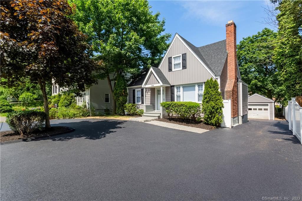 1748 Stratfield Road Fairfield, CT 06825 - Photo 3 of 30 a front view of a house with a garden