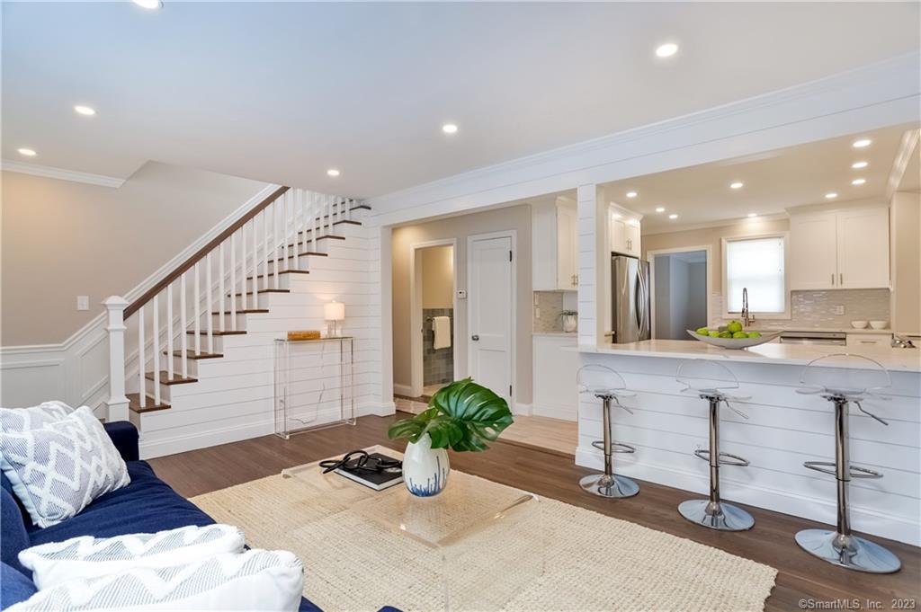 1748 Stratfield Road Fairfield, CT 06825 - Photo 4 of 30 a view of a hallway with furniture and a potted plant