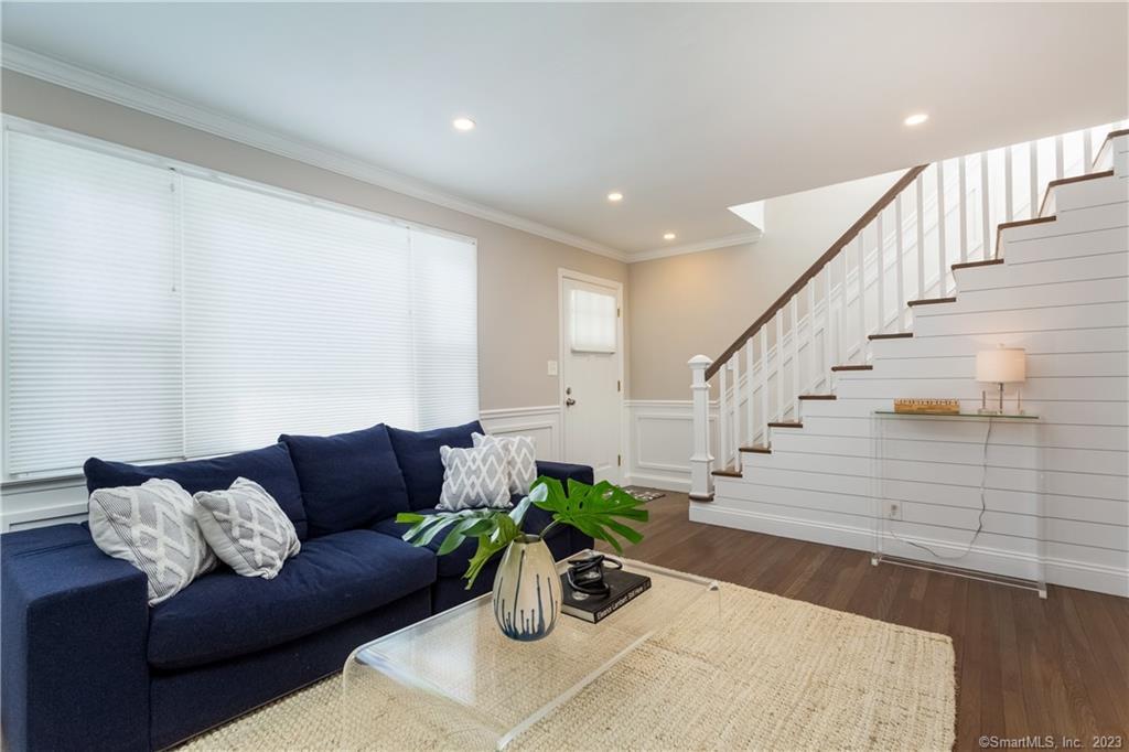 1748 Stratfield Road Fairfield, CT 06825 - Photo 7 of 30 a living room with furniture and wooden floor