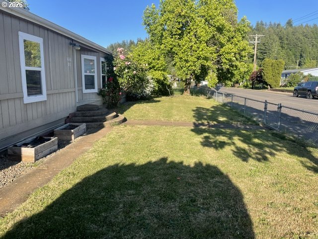 5660 Daisy Street, Unit 31 Springfield, OR 97478 - Photo 6 of 44 a view of a house with a yard